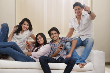 Portrait of youngsters on a sofa 