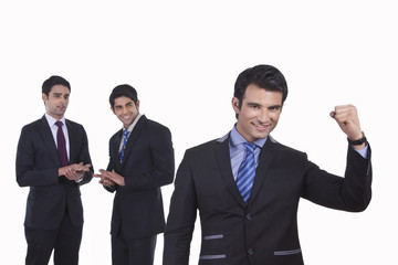 Colleagues clap as fellow businessman rejoices