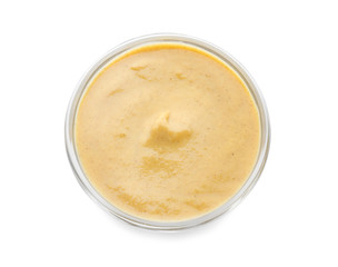 Bowl of delicious mustard sauce on white background