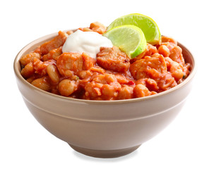 Bowl with delicious turkey chili on white background