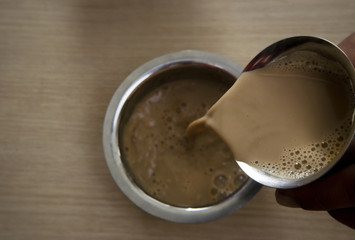 Filter coffee being poured into a dabarah 