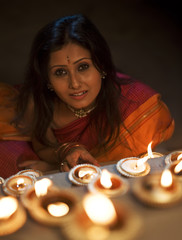 Woman with diyas on Diwali 