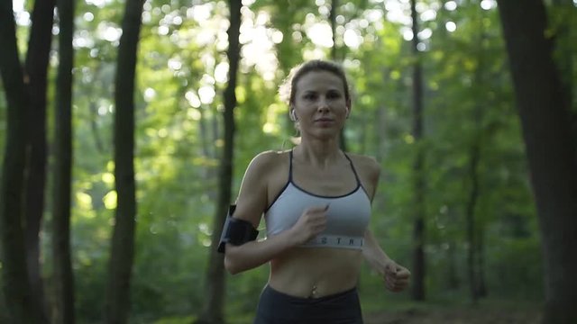 Athletic Woman Running in the Morning Sunrise