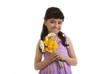 Girl holding flowers