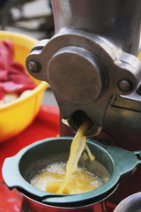 Juicer discharging lime juice in container