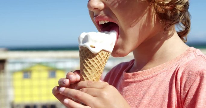 Boy having ice cream at beach