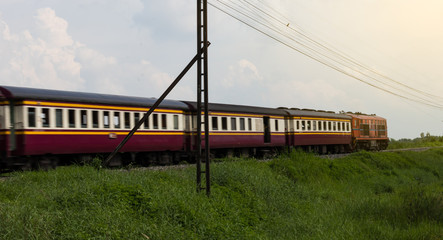 Obraz premium Trains blur on the grass.