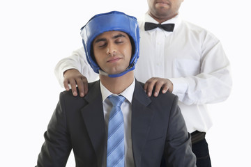 Businessman in boxing gear getting a massage 