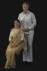Portrait of Indian senior couple dressed in retro style