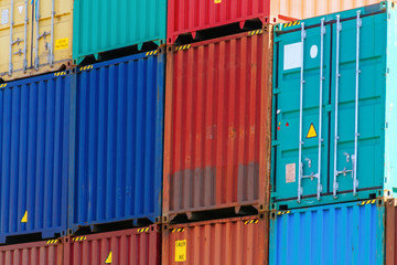 Fototapeta premium Several colorful containers stacked in a port