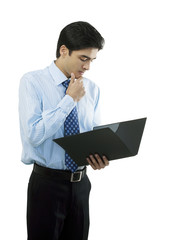 Businessman looking at a file 