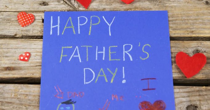 Paintings and happy fathers day message on paper