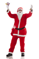 Full length of cheerful Santa Claus with chocolates over white background 