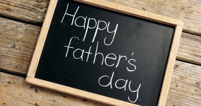 Happy fathers day message written on slate