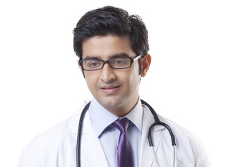 Fototapeta premium Handsome male doctor smiling over white background 