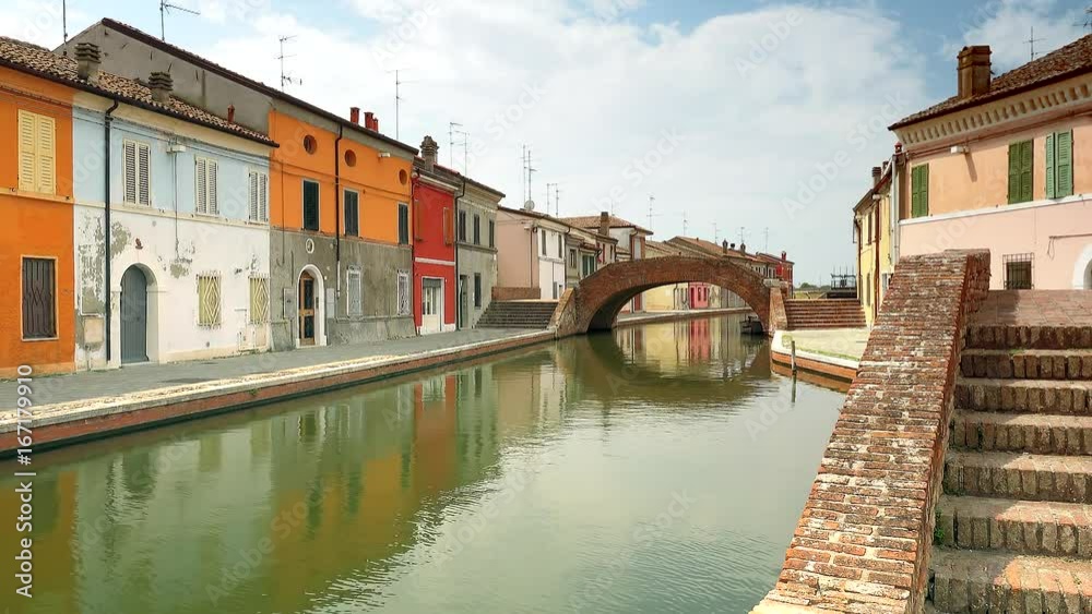 Canvas Prints venetian atmospheres of water flowing under bridges of an old lagoon town near ferrara in color grad