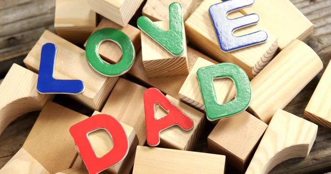 Text love dad arranged on wooden blocks