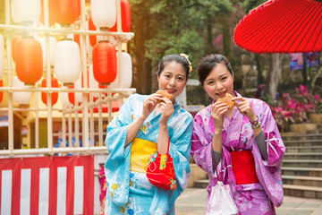 young female students wearing the kimono costume