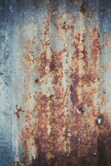 Old rusty corrugated tin zinc metal wall in vintage tone