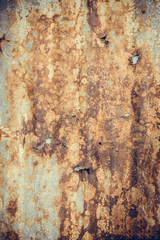 Old rusty corrugated tin zinc metal wall in vintage tone