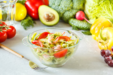 Zucchini pasta with shrimps and avocado.