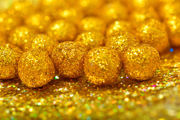 shiny sphere made of golden glitters with sparkles and glares.