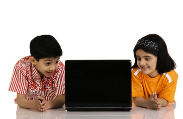 Children looking at the laptop 