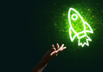 Man palm presenting Rocket web icon as technology concept
