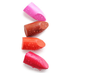 Colorful lipsticks on a white background