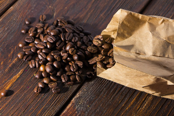 Fragrant roasted coffee on a wooden background