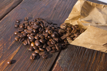Fragrant roasted coffee on a wooden background