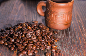 Fragrant roasted coffee on a wooden background