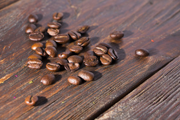 Fragrant roasted coffee on a wooden background