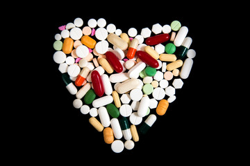 A heart shaped made of pills