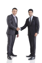 Portrait of two businessmen shaking hands 
