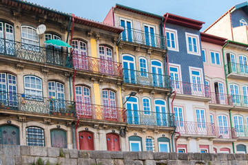 Fototapeta na wymiar Porto in Portugal, typical houses on the river Douro, colored buildings 