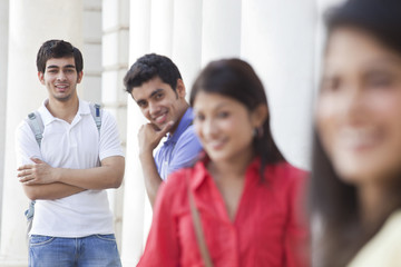 Focus on man with his friends in the foreground 