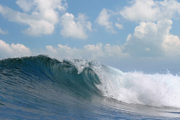 rough white blue ocean wave falling down