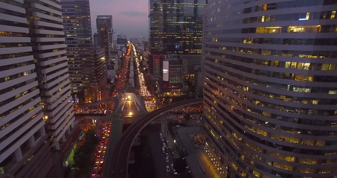 Office Blocks and Busy Streets in Sathorn District, Bangkok, Thailand, Aerial Drone Shot
