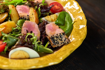 Salad with tuna and vegetables on a nice plate jpg