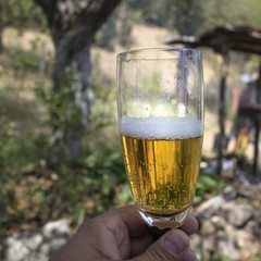 Man holding a glass of beer