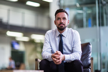 Businessman looking out of window 