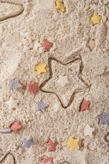 Abstract Christmas food background with cookies molds and flour