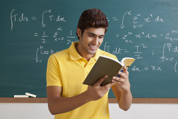 College student reading a book