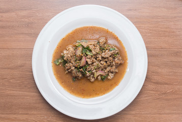 Spicy minced pork salad on plate