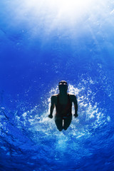 Obraz na płótnie Canvas professional female sport master smiling underwater