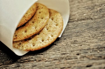 cracker in the paper wrapped on the wooden background,decoration food
