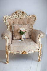 White chair with flower bouqet