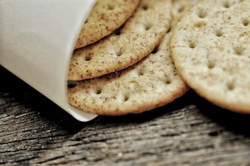 cracker in the paper wrapped on the wooden background,decoration food
