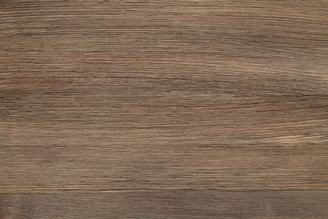 Natural color wooden floor surface. Textured background from woodnut planks. Horizontal grain.